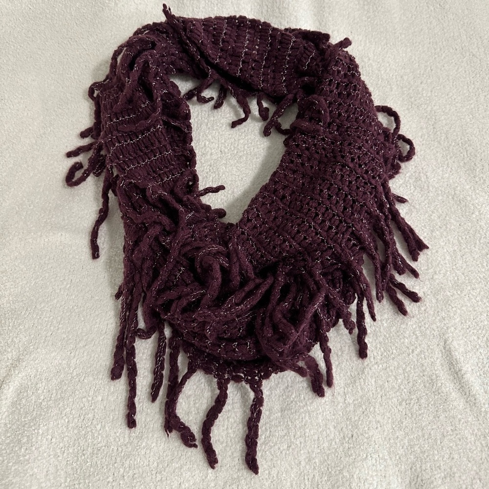Dark purple knit infinity scarf with silver thread and tassels